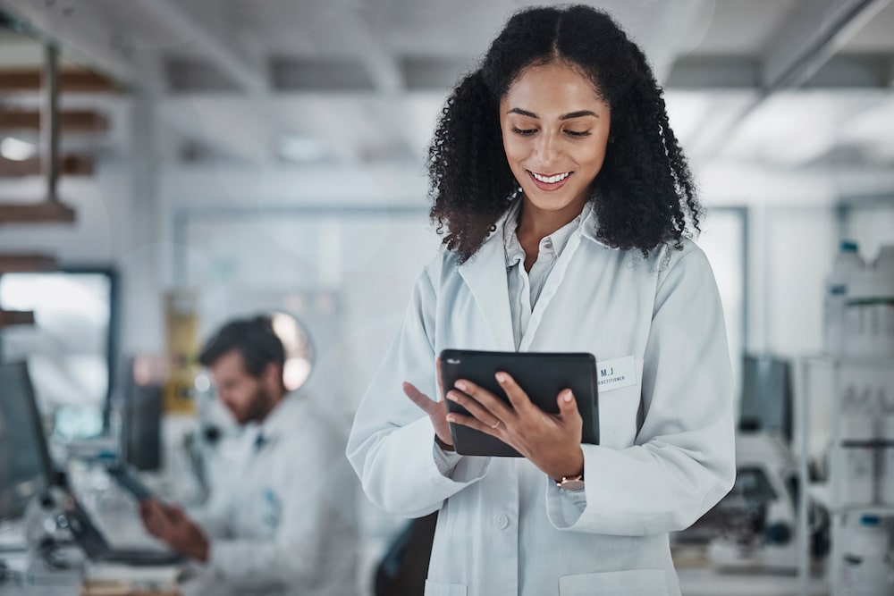 A staff member at a lab is able to remotely monitor critical parameters related to temperature in lab freezers